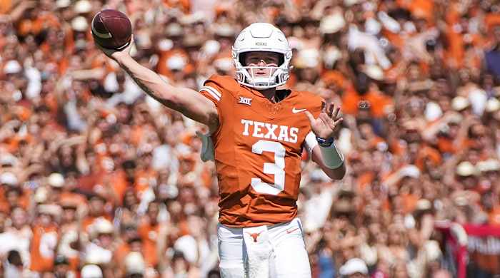 Texas Longhorns quarterback Quinn Ewers throws for a touchdown against the Oklahoma Sooners.