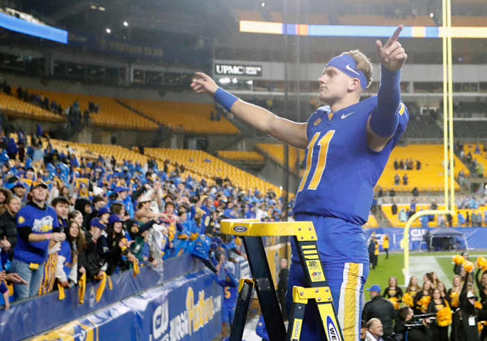 Oct 14, 2023; Pittsburgh, Pennsylvania, USA; Pittsburgh Panthers quarterback Christian Veilleux (11) leads the PITT band in the playing of the Alma Mater after defeating the Louisville Cardinals at Acrisure Stadium. Pittsburgh won 38-21. Mandatory Credit: Charles LeClaire-USA TODAY Sports