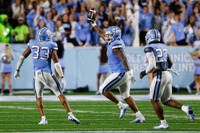 Oct 14, 2023; Chapel Hill, North Carolina, USA; North Carolina Tar Heels defensive lineman Myles Murphy (8) celebrates after recovering a fumble against the Miami Hurricanes in the second half at Kenan Memorial Stadium. Mandatory Credit: Nell Redmond-USA TODAY Sports
