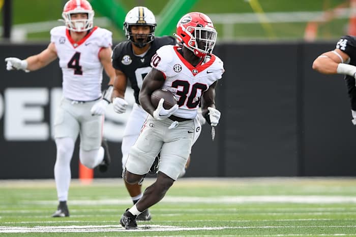 Oct 14, 2023; Nashville, Tennessee, USA; Georgia Bulldogs running back Daijun Edwards (30) runs the ball against the Vanderbilt Commodores during the second half at FirstBank Stadium.