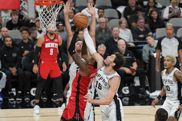 San Antonio Spurs forward Cedi Osman (16) blocks a shot by Houston Rockets forward Jabari Smith Jr. (10) in the first half at the Frost Bank Center.