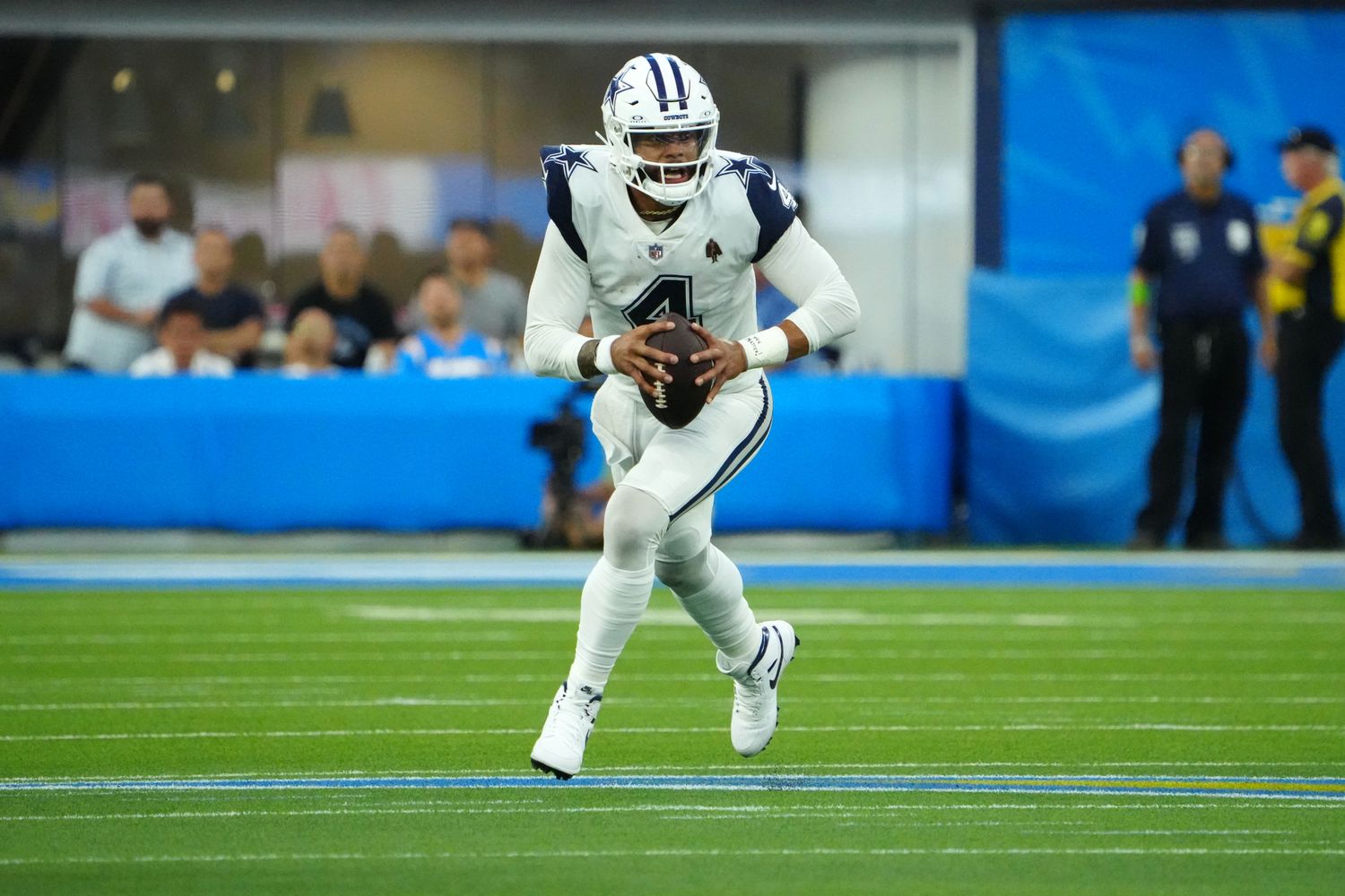 Oct 16, 2023; Inglewood, California, USA; Dallas Cowboys quarterback Dak Prescott (4) carries the ball against the Los Angeles Chargers in the first half at SoFi Stadium. Mandatory Credit: Kirby Lee-USA TODAY Sports