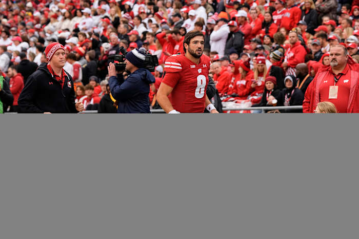 Oct 14, 2023; Madison, Wisconsin, USA; Wisconsin Badgers quarterback Tanner Mordecai (8) runs to the locker room during the second quarter against the Iowa Hawkeyes at Camp Randall Stadium. Mandatory Credit: Jeff Hanisch-USA TODAY Sports