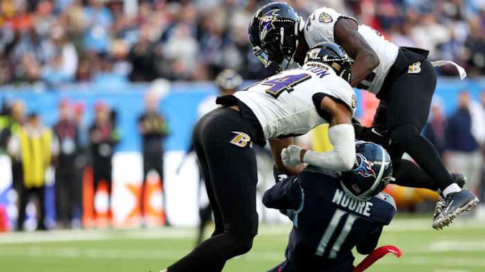 Ravens S Kyle Hamilton hits Titans receiver Chris Moore in the head during the Ravens' 23-16 win in London.
