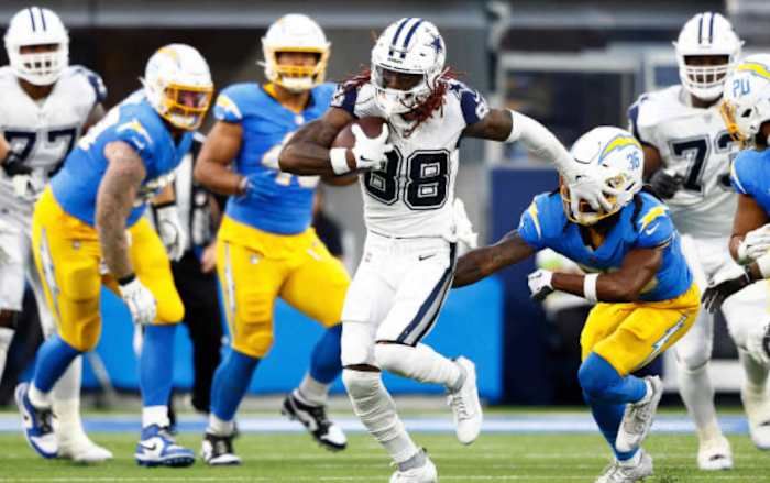 Lamb weaves through the Chargers defense on Monday night.