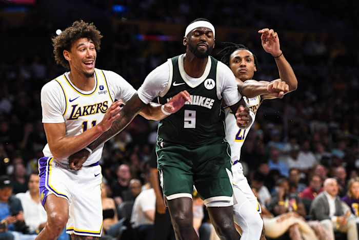 Milwaukee Bucks forward Bobby Portis (9) battles Los Angeles Lakers center Jaxson Hayes (11) and forward Maxwell Lewis (21) 
