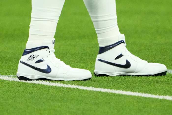View of Dallas Cowboys quarterback Dak Prescott's white and blue Air Jordan cleats.