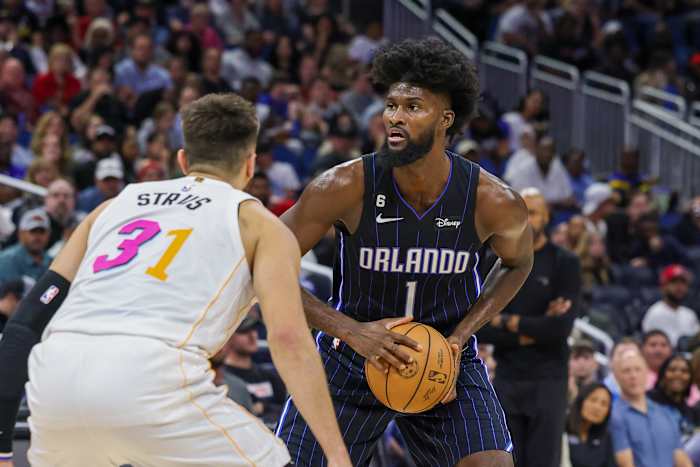 Isaac looks for an open teammate against the Miami Heat. 