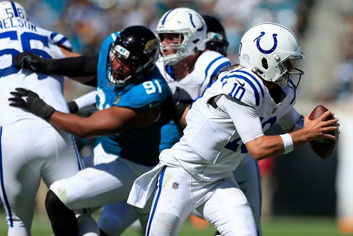 Indianapolis Colts quarterback Gardner Minshew (10) is flushed from the pocket during the third quarter of an NFL football matchup Sunday, Oct. 15, 2023 at EverBank Stadium in Jacksonville, Fla. The Jacksonville Jaguars defeated the Indianapolis Colts 37-20. [Corey Perrine/Florida Times-Union]