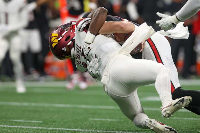 Sam Howell is sacked by a Falcons player