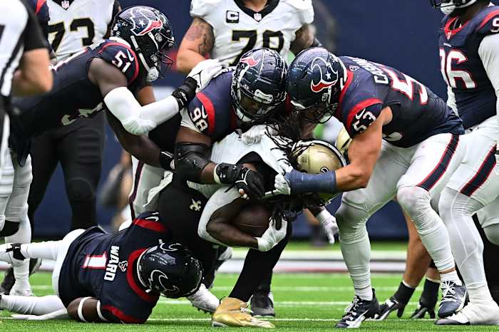 Oct 15, 2023; Houston, Texas, USA; Houston Texans defensive tackle Sheldon Rankins (98), linebacker Blake Cashman (53), safety Jimmie Ward (1) and defensive end Will Anderson Jr. (51) bring down New Orleans Saints running back Alvin Kamara (41) during the fourth quarter at NRG Stadium. Mandatory Credit: Maria Lysaker-USA TODAY Sports
