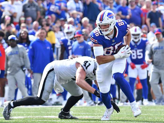 Kincaid fights through a tackle during a Week 2 game against the Las Vegas Raiders.