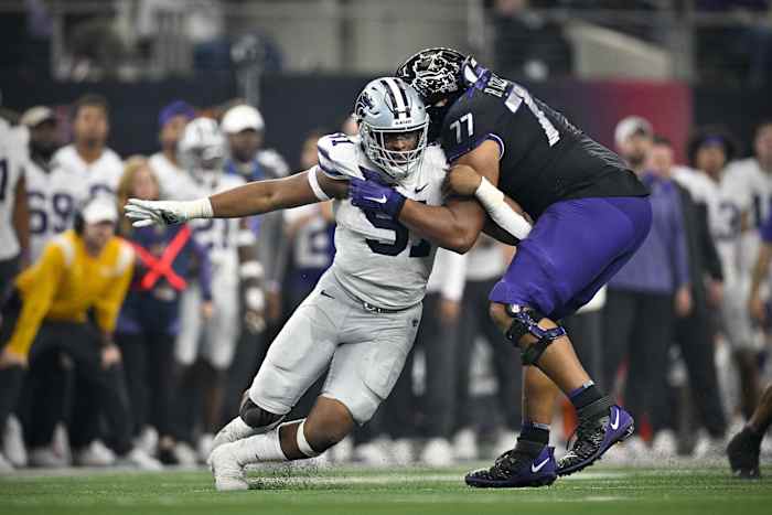 Dec 3, 2022; Arlington, TX, USA; Kansas State Wildcats defensive end Felix Anudike-Uzomah (91) and TCU Horned Frogs offensive tackle Brandon Coleman (77) in action during the game between the TCU Horned Frogs and the Kansas State Wildcats at AT&T Stadium.