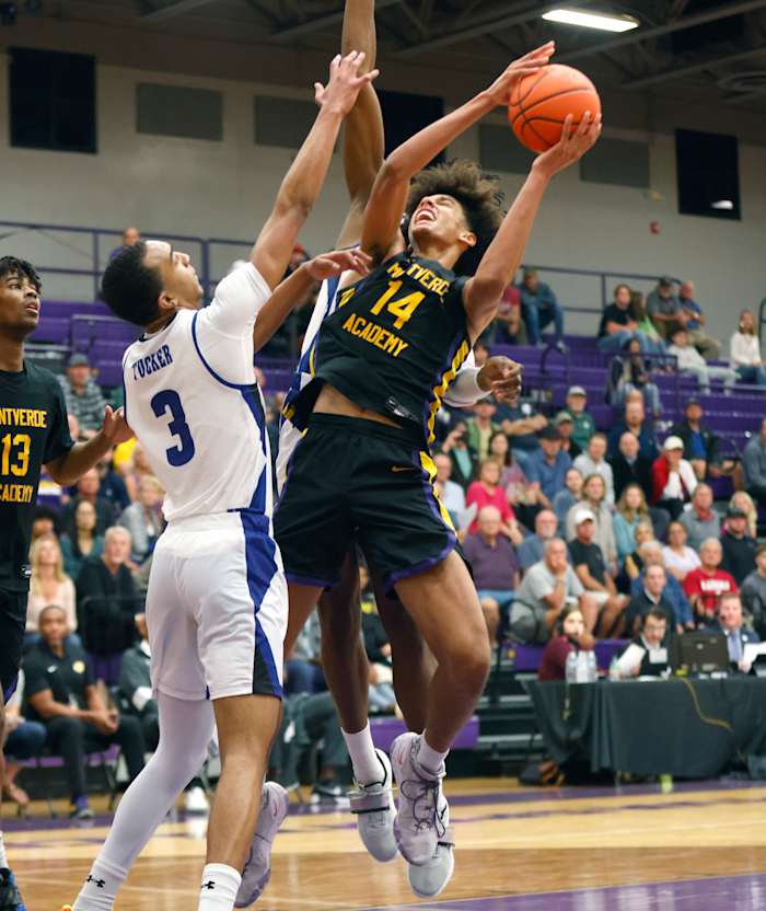 Dec 1, 2022; Montverde, Florida, USA; Montverde Academy forward Asa Newell (14) shoots past IMG Academy forward Bryson Tucker (3) during the second half of the Sunshine Classic basketball tournament at Mills Championship Court on the campus of Montverde Academy. Mandatory Credit: Reinhold Matay-USA TODAY Sports