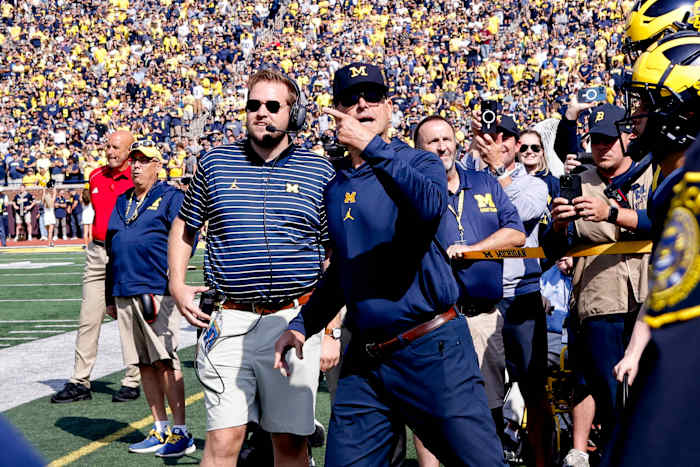 Sep 23, 2023; Ann Arbor, Michigan, USA; Michigan Wolverines head coach Jim Harbaugh leads his players before a game against the Rutgers Scarlet Knights at Michigan Stadium. Mandatory Credit: Rick Osentoski-USA TODAY Sports