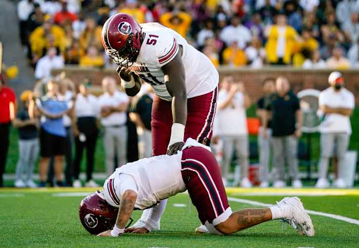 Tree Babalade checking on Spencer Rattler after he took a hit from a Missouri defender (21st Oct., 2023)