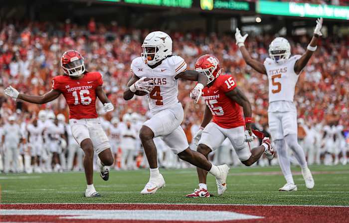 Texas running back C.J. Baxter (No. 4) crosses the goal line for a touchdown in the fourth quarter against Houston at TDECU Stadium in Houston, Texas.