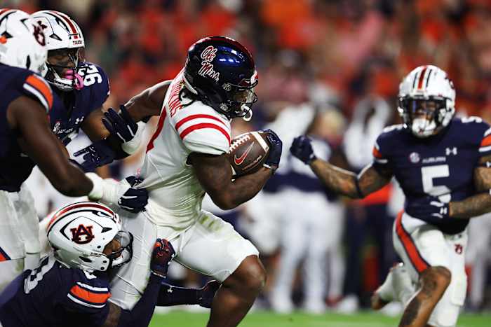 Oct 21, 2023; Auburn, Alabama, USA; Auburn defenders try to tackle Mississippi Rebels running back Quinshon Judkins (4) during the second quarter at Jordan-Hare Stadium. Mandatory Credit: John Reed-USA TODAY Sports