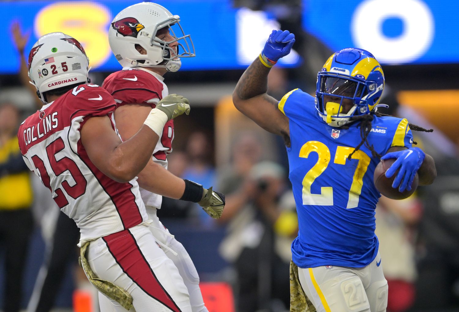 Nov 13, 2022; Inglewood, California, USA; Los Angeles Rams running back Darrell Henderson Jr. (27) beats Arizona Cardinals linebacker Zaven Collins (25) and linebacker Cameron Thomas (97) into the end zone for a touchdown in the second half at SoFi Stadium. Mandatory Credit: Jayne Kamin-Oncea-USA TODAY Sports