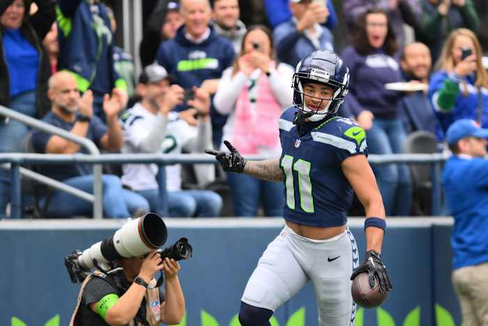 Oct 22, 2023; Seattle, Washington, USA; Seattle Seahawks wide receiver Jaxon Smith-Njigba (11) celebrates after scoring a touchdown against the Arizona Cardinals during the first half at Lumen Field.