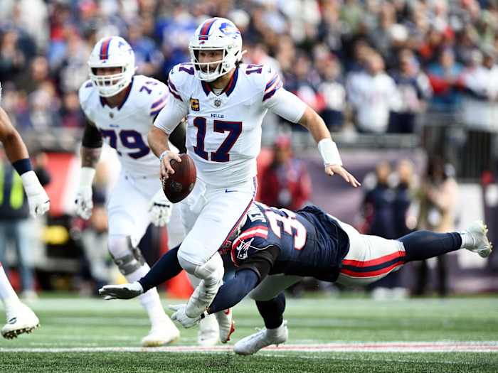 Buffalo Bills quarterback Josh Allen (17) runs against the New England Patriots during the first half at Gillette Stadium.