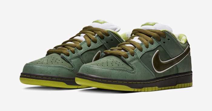 Side view of green and white Nike Dunk sneakers.
