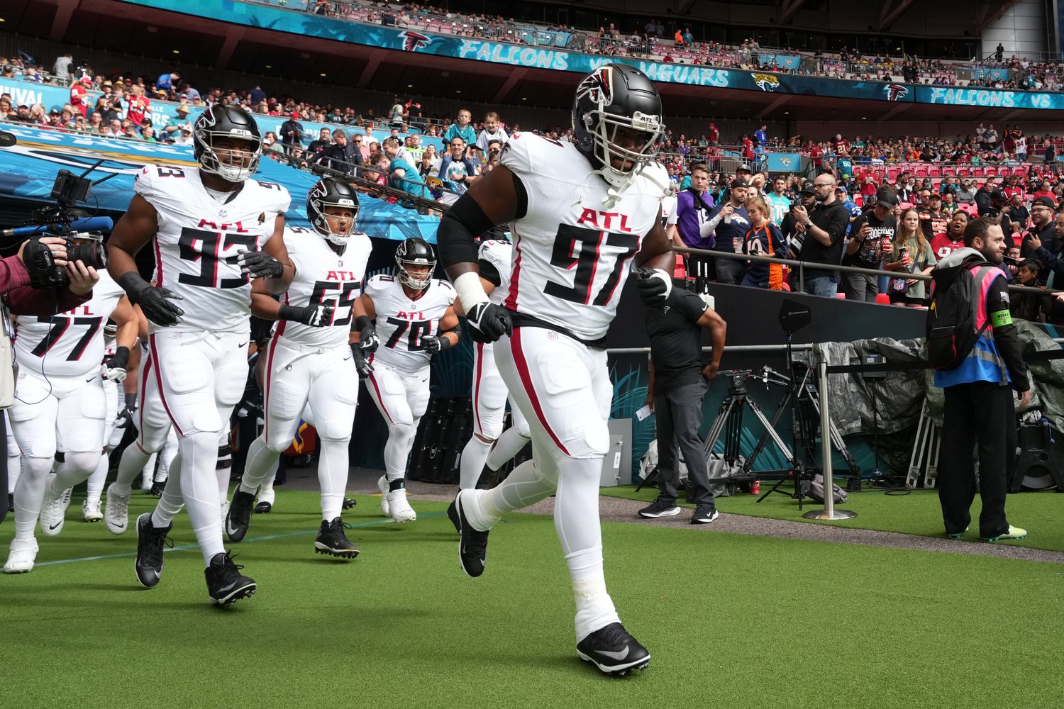 Oct 1, 2023; London, United Kingdom; Atlanta Falcons defensive end Grady Jarrett (97), defensive tackle Calais Campbell (93) and guard Matthew Bergeron (65) enter the field during an NFL International Series game against the Jacksonville Jaguars at Wembley Stadium. Mandatory Credit: Kirby Lee-USA TODAY Sports