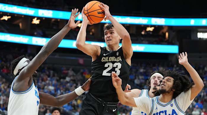 Colorado Buffaloes forward Tristan da Silva looks to shoot between UCLA Bruins forward Adem Bona and guard Tyger Campbell.