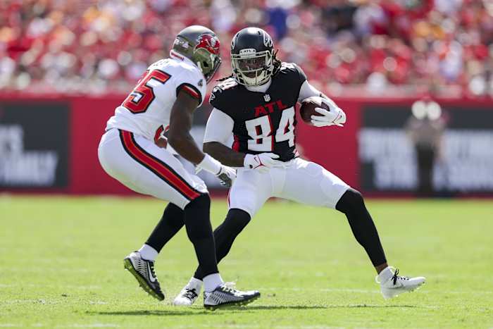 Oct 22, 2023; Tampa, Florida, USA; Atlanta Falcons running back Cordarrelle Patterson (84) runs with the ball defended by Tampa Bay Buccaneers cornerback Jamel Dean (35) in the first quarter at Raymond James Stadium. Mandatory Credit: Nathan Ray Seebeck-USA TODAY Sports