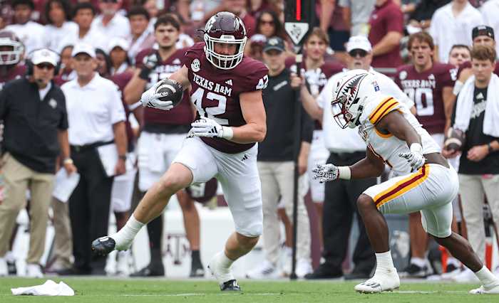 Sep 16, 2023; College Station, Texas, USA; Texas A&M Aggies tight end Max Wright (42) makes a reception as Louisiana Monroe Warhawks linebacker Travor Randle (4) defends during the first quarter at Kyle Field.