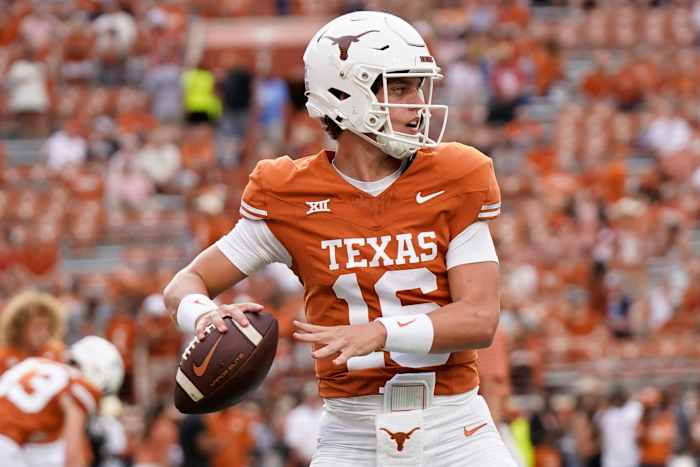 Texas Longhorns quarterback Arch Manning (16) warms up before a game against the Wyoming Cowboys at Darrell K Royal-Texas Memorial Stadium.