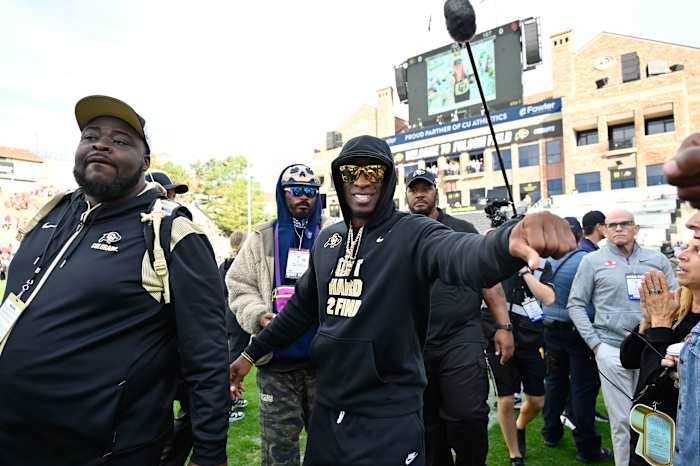 Colorado Buffaloes head coach Deion Sanders walks on the field prior to the game against the USC Trojans at Folsom Field