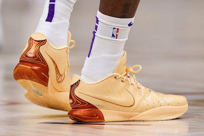 Side view of Los Angeles Lakers forward LeBron James' orange Nike sneakers.