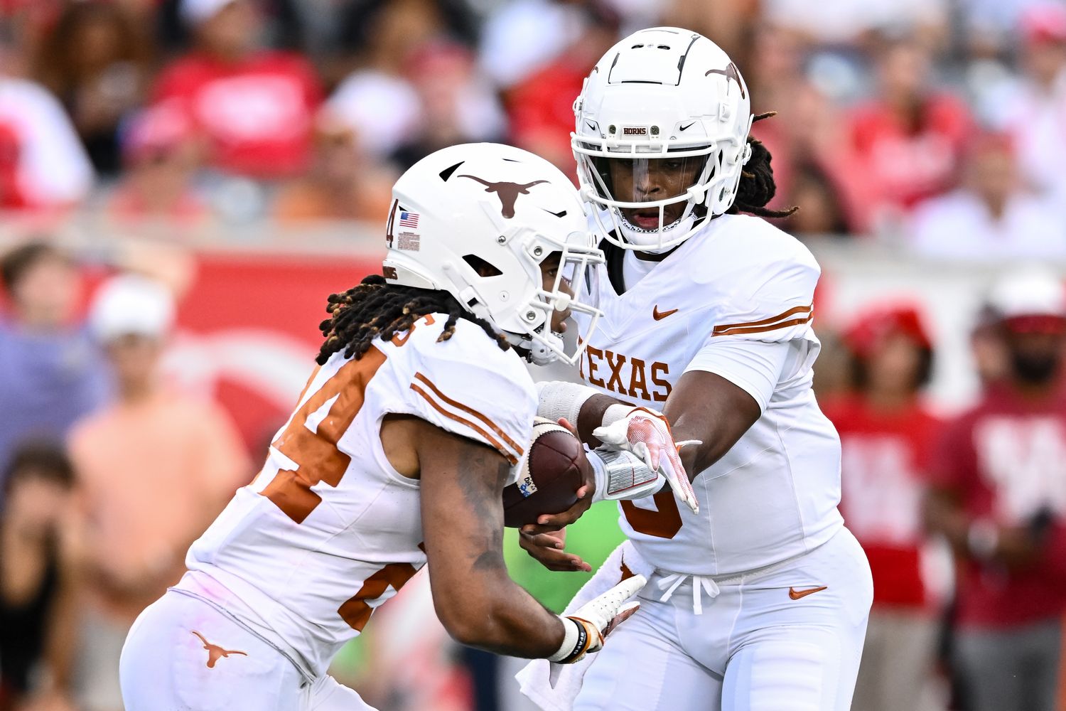 Texas Longhorns quarterback Maalik Murphy (6) hands off the ball to running back Jonathon Brooks (24) during the third quarter against the Houston Cougars at TDECU Stadium.