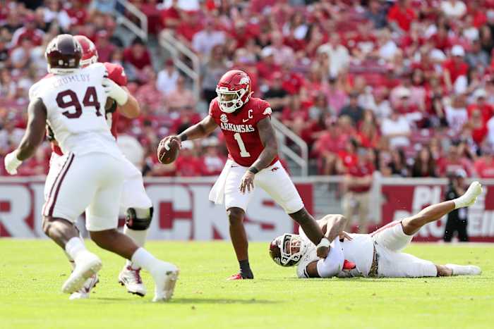 Oct 21, 2023; Fayetteville, Arkansas, USA; Mississippi State Bulldogs linebacker Nathaniel Watson (14) holds on to Arkansas Razorbacks quarterback KJ Jefferson during the first half at Donald W. Reynolds Razorback Stadium. Mandatory Credit: Nelson Chenault-USA TODAY Sports