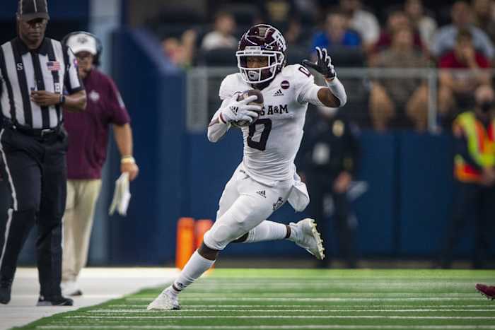 Ainias Smith making attempting to stay inbounds during a play