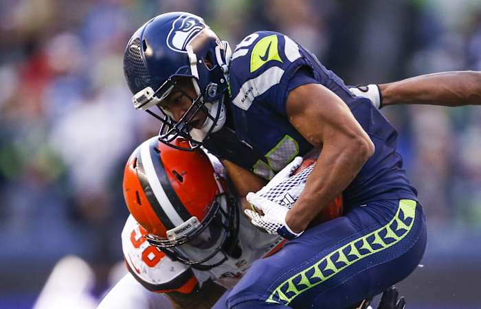 Seattle Seahawks wide receiver Tyler Lockett (16) is tackled on a kickoff return by Cleveland Browns defensive tackle Jamie Meder (98) during the fourth quarter at CenturyLink Field.