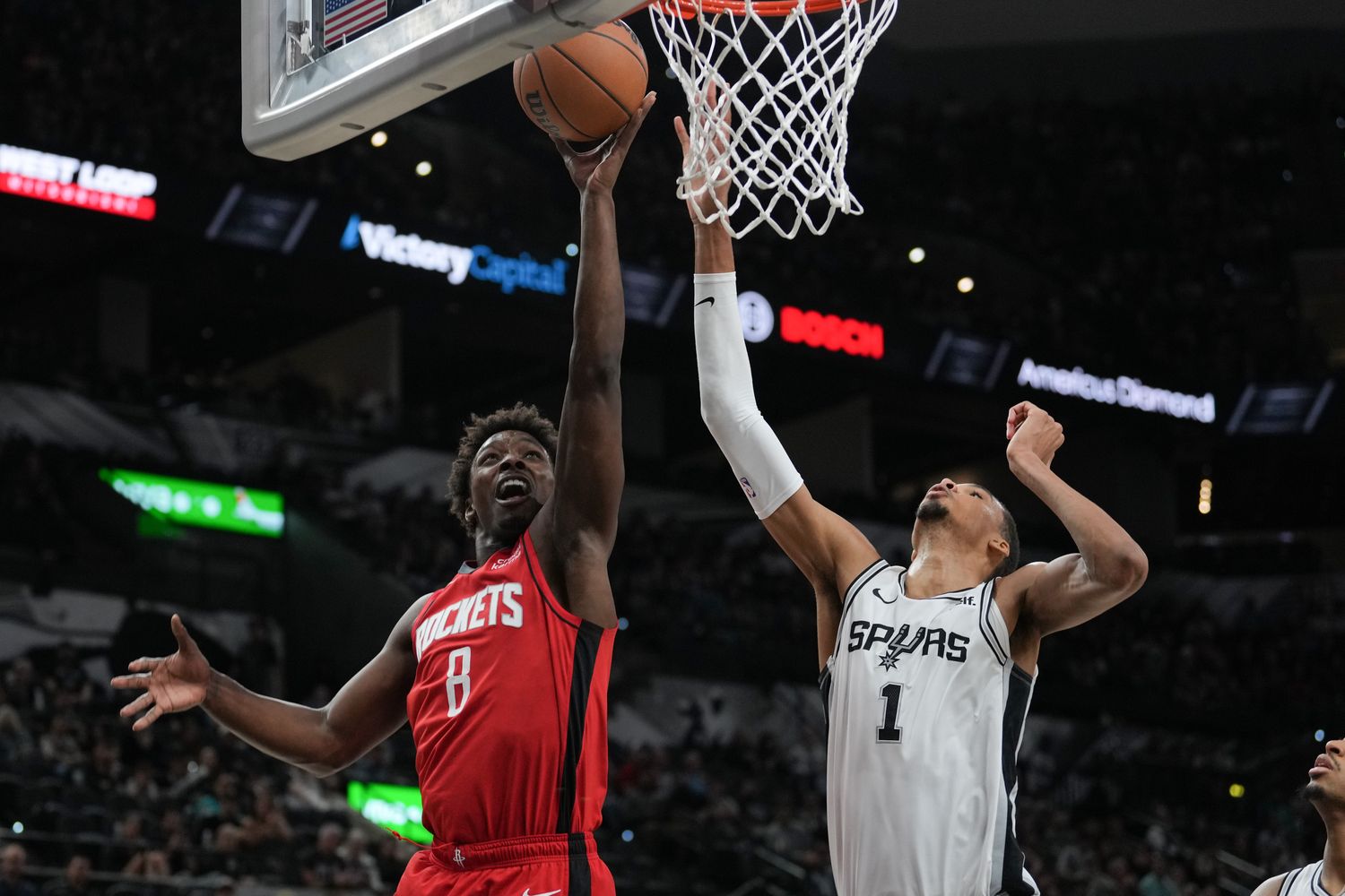 Rockets forward Jae'Sean Tate shoots in front of San Antonio Spurs center Victor Wembanyama (1) in the second half at the Frost Bank Center.