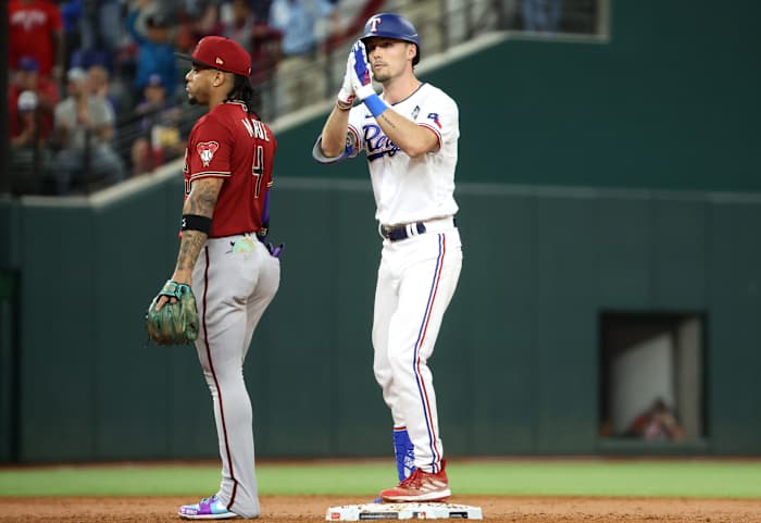 Oct 27, 2023; Arlington, TX, USA; Texas Rangers center fielder Evan Carter (32) reacts after a double during the third inning in game one of the 2023 World Series against the Arizona Diamondbacks at Globe Life Field. Mandatory Credit: Kevin Jairaj-USA TODAY Sports