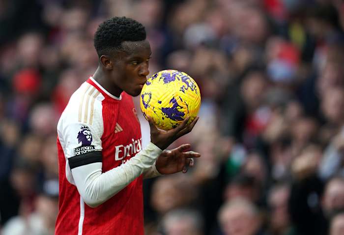Eddie Nketiah pictured kissing the match ball after scoring a hat-trick for Arsenal against Sheffield United in October 2023