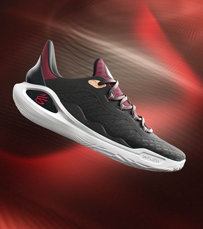 Side view of Stephen Curry's black, red, and white basketball shoes.