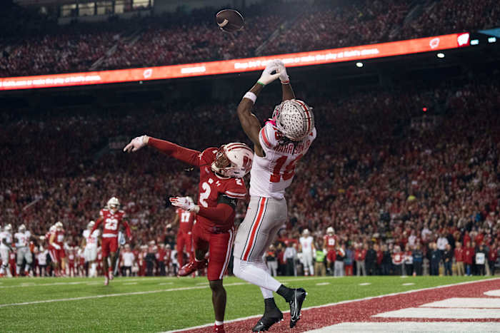 Wisconsin Badgers cornerback Ricardo Hallman (2) defends the pass intended for Ohio State Buckeyes wide receiver Marvin Harrison Jr. (18) during the first quarter at Camp Randall Stadium.
