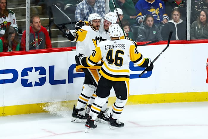 Oct 12, 2019; Saint Paul, MN, USA; Pittsburgh Penguins center Adam Johnson (47) celebrates with center Zach Aston-Reese (46) after Johnson scored a goal against the Minnesota Wild in the second period at Xcel Energy Center.