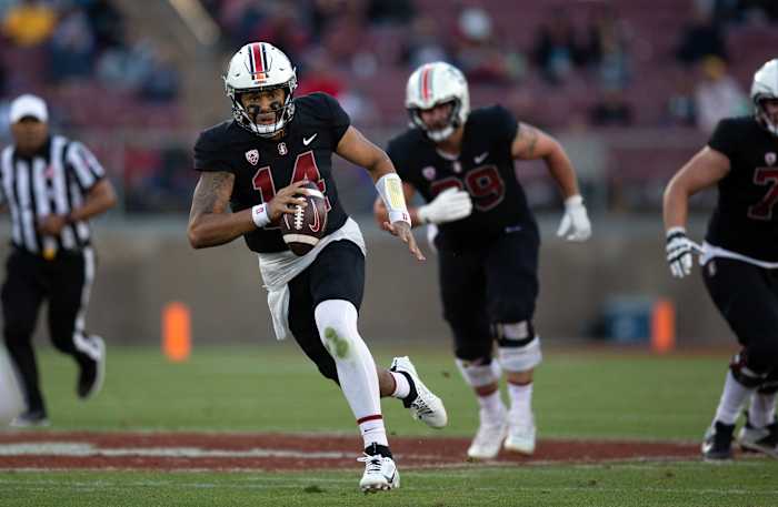 Oct 28, 2023; Stanford, California, USA; Stanford Cardinal quarterback Ashton Daniels (14) scrambles out of the pocket against the Washington Huskies during the second quarter at Stanford Stadium. Mandatory Credit: D. Ross Cameron-USA TODAY Sports