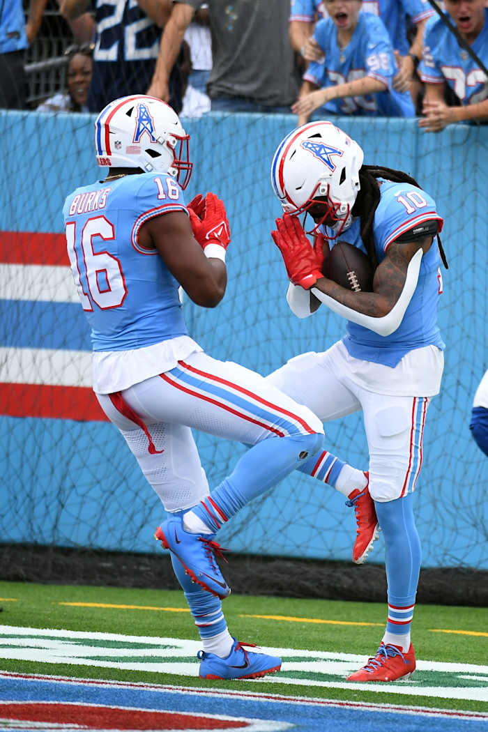 Tennessee Titans wide receiver DeAndre Hopkins (10) celebrates with wide receiver Treylon Burks (16) after a touchdown during the first half against the Atlanta Falcons at Nissan Stadium.