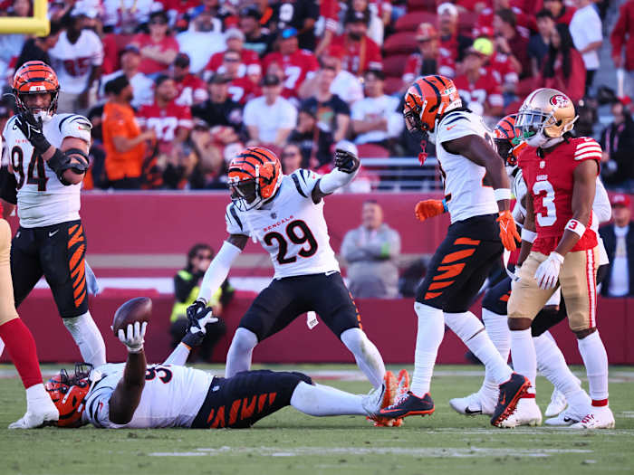 Oct 29, 2023; Santa Clara, California, USA; Cincinnati Bengals cornerback Cam Taylor-Britt (29) celebrates above defensive tackle BJ Hill (92) after Hill recovered a San Francisco 49ers fumble during the fourth quarter at Levi's Stadium. Mandatory Credit: Kelley L Cox-USA TODAY Sports