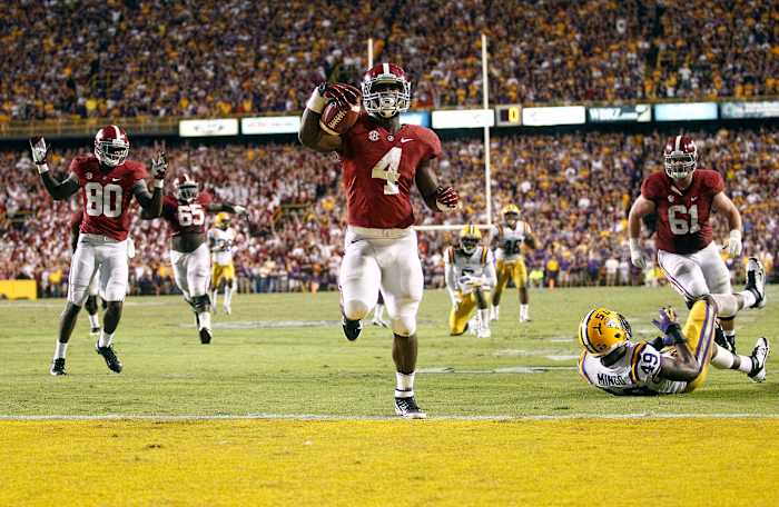 Alabama Crimson Tide running back T.J. Yeldon (4) scores a touchdown during the fourth quarter against the LSU Tigers at Tiger Stadium. Alabama defeated LSU 21-17.