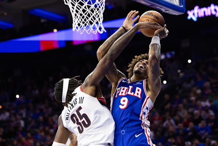 Philadelphia 76ers guard Kelly Oubre Jr. is fouled by Portland Trail Blazers center Robert Williams III