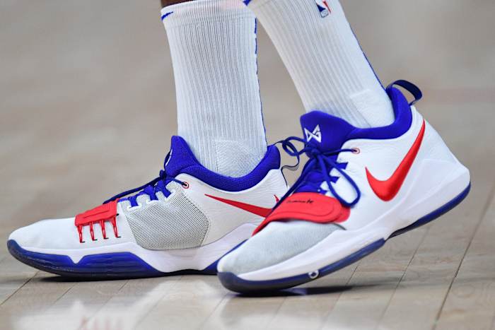 Los Angeles Clippers forward Paul George's white, red, and blue Nike sneakers.