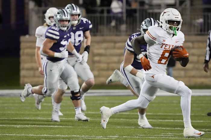 Texas Longhorns wide receiver Xavier Worthy (8) carries the ball during the Texas Longhorns football game against Kansas State at Bill Snyder Family Stadium in Manhattan, Kansas on Saturday, Nov. 5, 2022.